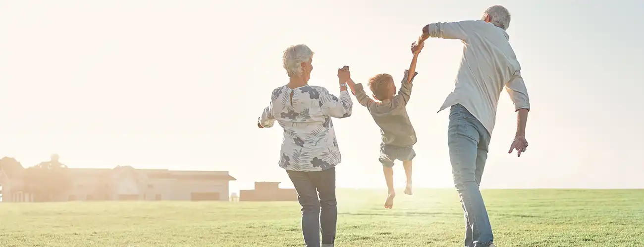grandparents playing with child