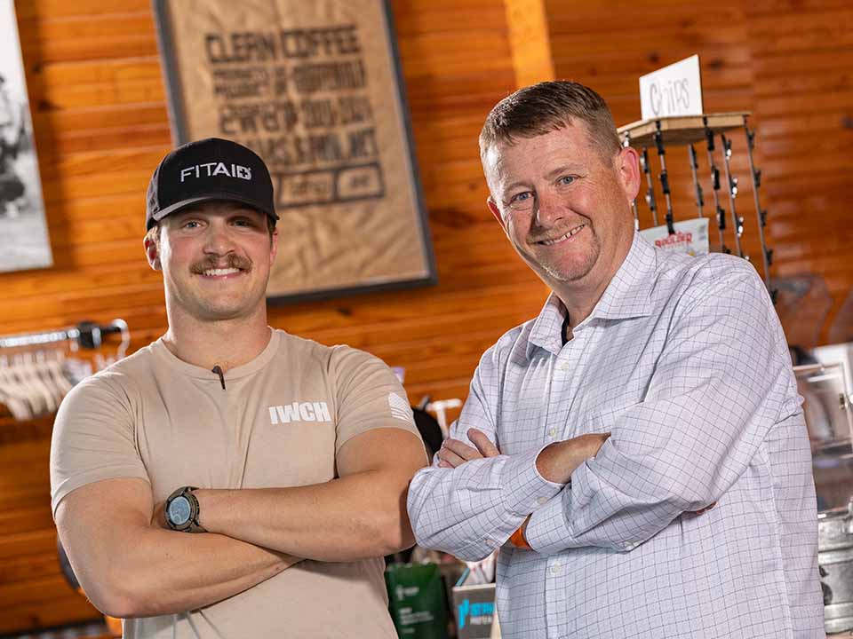 Ryan and barista at Iron Wolf coffee shop